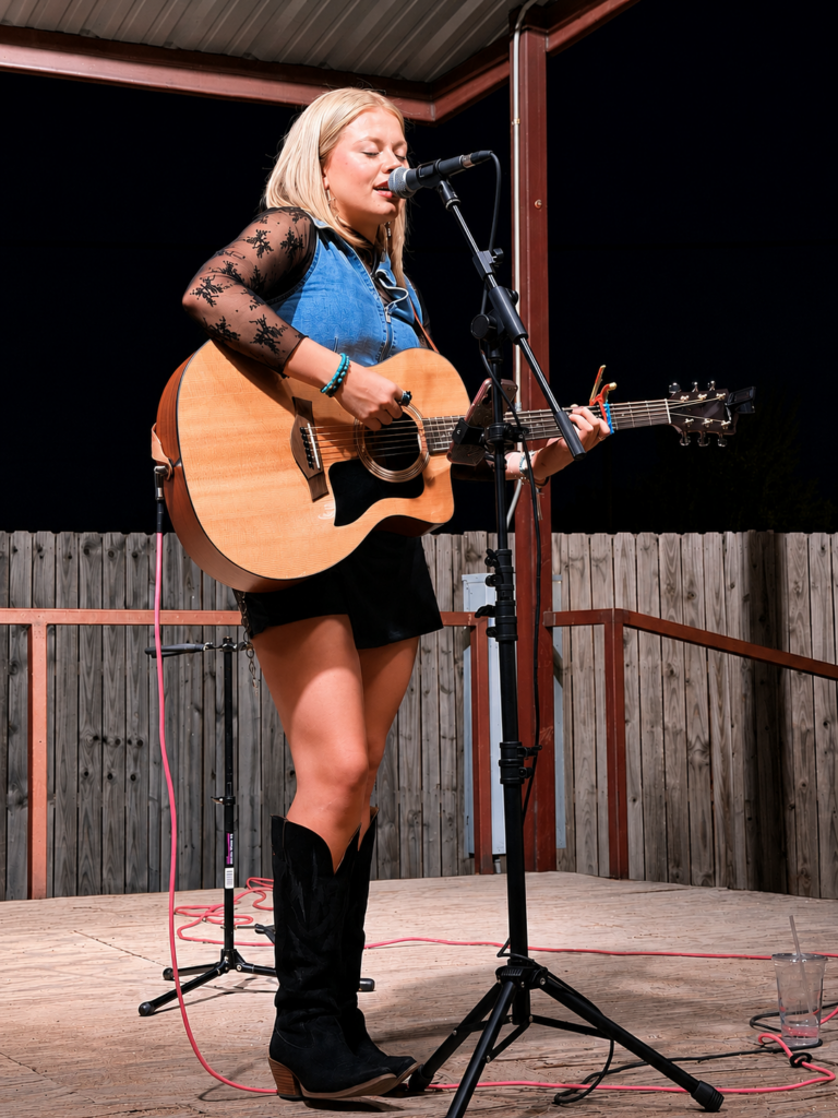 Local artist performing live at North Texas summer event - outdoor stage