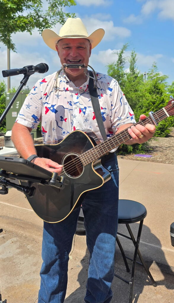 Local artist performing live at North Texas summer event - guitarist