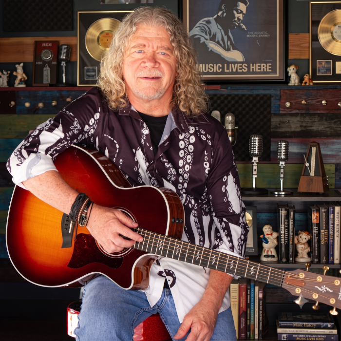 Frisco classic rock guitarist and solo acoustic vocalist Keith posing with his guitar.