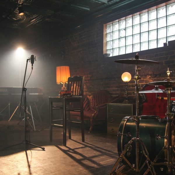 Microphone and instruments set up on stage for a performance